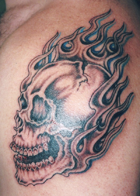 Skull and flames tattoo by Jennifer Overbury
